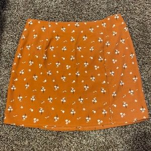 Aeropostale / size: L / burnt orange skirt w flowers